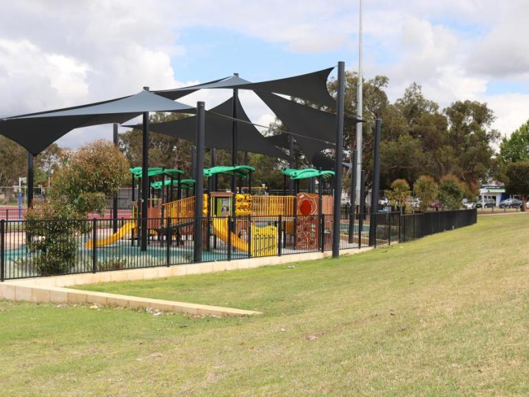 Playground equipment protected by the sun with shade sails